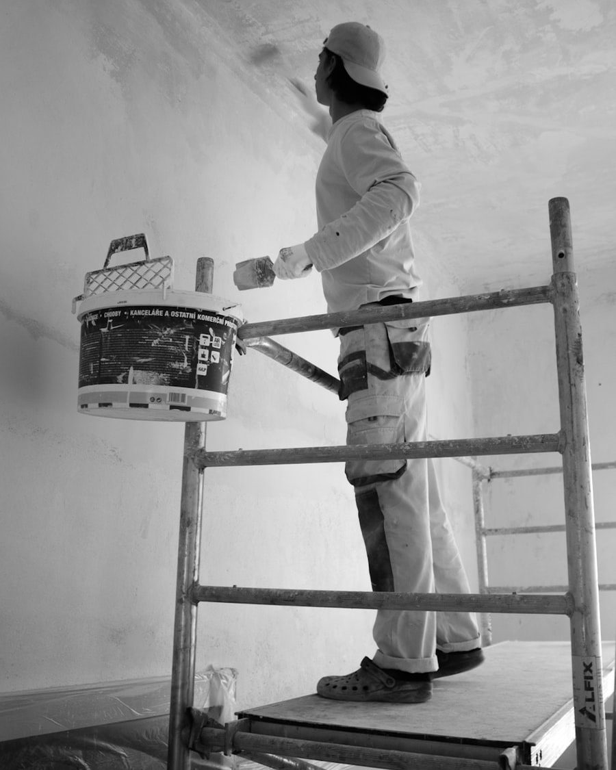 Head painter rolling a wall